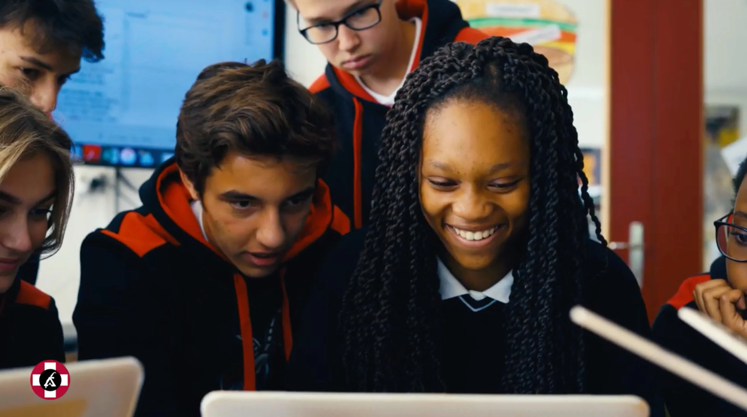 Leysin American School students looking at a computer